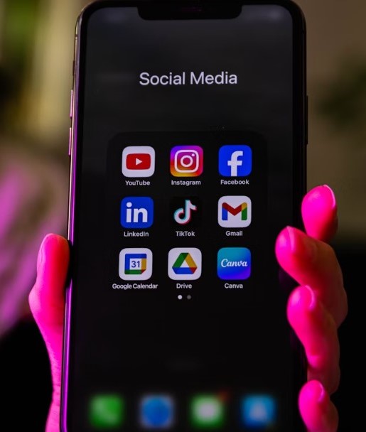 A smartphone showing social media icons on its screen.